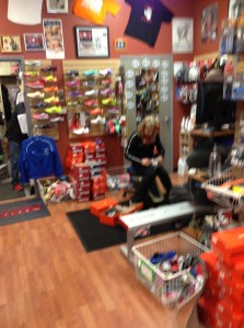 Caroline Cayton is in constant motion fitting customers in the St. Charles, Illinois Dick Pond Athletics store. 