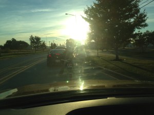 Click to enlarge photo. You can still hardly see details between the sun, a dirty windshield and early morning shadows. 