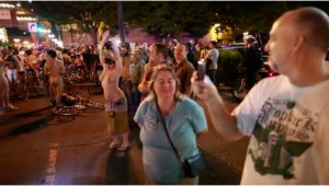 Even fans get into the action at the Naked Bike Ride. Which is pretty decent of them. Just saying.