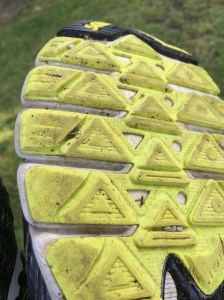 Here is an image of my right show sole. It evidences wear on the outside, indicating a general position of supination and some forefoot striking. This is the result of orthotics and my running form. 