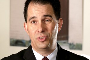 Wisconsin Gov. Scott Walker talks during an interview with the Associated Press in New Orleans, Monday, May 18, 2015. Republicans clashed over the future of government surveillance programs on Monday, highlighting a deep divide among the GOP's 2016 presidential class over whether the National Security Agency should be collecting American citizens' phone records in the name of preventing terrorism. Walker three times declined to say whether he supported reauthorizing the program. He said it was "important to be able to collect information like that," as long as there were unspecified privacy safeguards. After the interview, a spokesman emailed to say that Walker supported continuing the program as it exists, with the NSA storing American phone records. (AP Photo/Gerald Herbert)